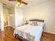 Cozy bedroom with wood floors and en-suite bathroom at 2071 Sifield Greens Way # 103, Sun City Center, FL 33573