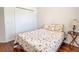 Bedroom with double bed, nightstand and wood floors at 2071 Sifield Greens Way # 103, Sun City Center, FL 33573