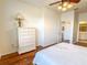 Light and airy bedroom with wood floors and ample closet space at 2071 Sifield Greens Way # 103, Sun City Center, FL 33573