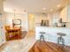 Dining area and kitchen with hardwood floors at 2071 Sifield Greens Way # 103, Sun City Center, FL 33573