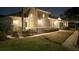 Well-lit villa at night, landscaped grounds, walkway at 2071 Sifield Greens Way # 103, Sun City Center, FL 33573