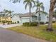 Two-story house with two-car garage and palm trees at 2071 Sifield Greens Way # 103, Sun City Center, FL 33573