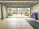 Garage with view of backyard and neighborhood at 2071 Sifield Greens Way # 103, Sun City Center, FL 33573