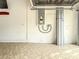 Garage interior with electrical panel and storage at 2071 Sifield Greens Way # 103, Sun City Center, FL 33573