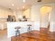 Kitchen with breakfast bar and access to hallway at 2071 Sifield Greens Way # 103, Sun City Center, FL 33573