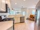 Modern kitchen with stainless steel appliances and a breakfast bar at 2071 Sifield Greens Way # 103, Sun City Center, FL 33573