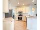 Bright kitchen featuring stainless steel appliances and ample counter space at 2071 Sifield Greens Way # 103, Sun City Center, FL 33573