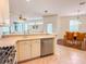 Spacious kitchen with stainless steel appliances and light-colored cabinets at 2071 Sifield Greens Way # 103, Sun City Center, FL 33573