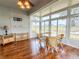 Sunroom with lake view and wicker furniture at 2071 Sifield Greens Way # 103, Sun City Center, FL 33573