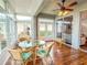 Bright sunroom with lake view and sliding doors at 2071 Sifield Greens Way # 103, Sun City Center, FL 33573