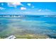 Aerial view of waterfront property, showcasing beautiful water and city skyline at 220 Belleview Blvd # 811, Belleair, FL 33756