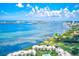 Aerial view of condo community near the water with golf course and bridge views at 220 Belleview Blvd # 811, Belleair, FL 33756