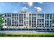 Aerial view of the building, showing parking and landscaping at 220 Belleview Blvd # 811, Belleair, FL 33756