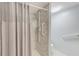 Accessible bathroom features a walk-in shower with safety grab bars for a safe and comfortable experience at 220 Belleview Blvd # 811, Belleair, FL 33756
