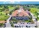 Golf clubhouse with parking lot and surrounding green space at 220 Belleview Blvd # 811, Belleair, FL 33756