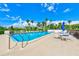 Inviting community pool with lounge chairs and tables at 220 Belleview Blvd # 811, Belleair, FL 33756