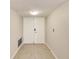 Simple entryway with double doors and light beige walls at 220 Belleview Blvd # 811, Belleair, FL 33756
