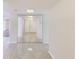 Bright entryway with mirrored closet doors and tile flooring at 220 Belleview Blvd # 811, Belleair, FL 33756