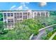 Two-story condo building with lush landscaping at 220 Belleview Blvd # 811, Belleair, FL 33756