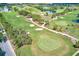 Aerial view of a beautiful golf course with lush green fairways and ponds at 220 Belleview Blvd # 811, Belleair, FL 33756