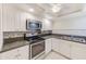 Modern kitchen with stainless steel appliances and white cabinets at 220 Belleview Blvd # 811, Belleair, FL 33756