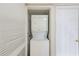 Convenient laundry closet with a stacked washer and dryer, maximizing space in your new home at 220 Belleview Blvd # 811, Belleair, FL 33756