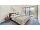 Serene main bedroom with a large window, neutral tones, and a comfortable bed at 220 Belleview Blvd # 811, Belleair, FL 33756