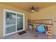 Patio featuring a ceiling fan and outdoor counterspace and a sliding glass door at 2803 W Lake Ave, Tampa, FL 33607