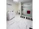 Updated bathroom with white vanity and walk-in shower at 2910 W Burke St, Tampa, FL 33614