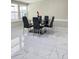 Dining area with glass table and black chairs at 2910 W Burke St, Tampa, FL 33614