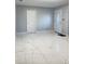 Bright entryway with white door and marble-look floors at 2910 W Burke St, Tampa, FL 33614
