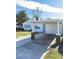 Front view of a renovated single story home with carport at 2910 W Burke St, Tampa, FL 33614