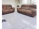 Living room with brown reclining sofas at 2910 W Burke St, Tampa, FL 33614