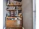 Stylish bar area with wood shelving, cabinet storage, and decorative accents at 30618 Tremont Dr, Wesley Chapel, FL 33543