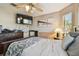 Bedroom with ceiling fan, TV and light wood decor at 30618 Tremont Dr, Wesley Chapel, FL 33543