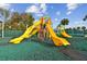 Community playground area with several colorful slides and climbing structures at 30618 Tremont Dr, Wesley Chapel, FL 33543