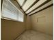 Bright bedroom with window and exposed beams at 3090 Arrowhead Rd, Venice, FL 34293
