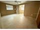 Simple bedroom with ceiling fan and access to another room at 3090 Arrowhead Rd, Venice, FL 34293