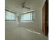 Well-lit bedroom with window and ceiling fan at 3090 Arrowhead Rd, Venice, FL 34293