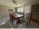Dining room with wood table and six chairs at 3090 Arrowhead Rd, Venice, FL 34293
