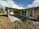 Ranch-style home with covered patio and side yard at 3090 Arrowhead Rd, Venice, FL 34293