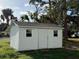 Detached storage shed with two windows and a door at 3090 Arrowhead Rd, Venice, FL 34293