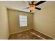 Well-lit bedroom with ceiling fan and window at 31247 Claridge Pl, Wesley Chapel, FL 33543