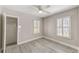 Bright bedroom with hardwood floors, closet, and window shutters at 3147 Prescott N St, St Petersburg, FL 33713