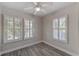 Bright bedroom with wood-look floors and plantation shutters at 3147 Prescott N St, St Petersburg, FL 33713