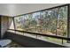 Balcony view of lush green trees and landscape with seating at 36750 Us Highway 19 # 24209, Palm Harbor, FL 34684