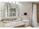 Bright bathroom with a granite vanity top, mirror and toilet at 36750 Us Highway 19 # 24209, Palm Harbor, FL 34684