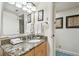 Bright bathroom with a granite countertop vanity, a large mirror and great lighting at 36750 Us Highway 19 # 24209, Palm Harbor, FL 34684