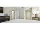 Hotel bedroom with a dresser, TV, and an exterior door to the hallway at 36750 Us Highway 19 # 24209, Palm Harbor, FL 34684