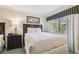 Comfortable bedroom with two beds, side table and nature-themed art at 36750 Us Highway 19 # 24209, Palm Harbor, FL 34684